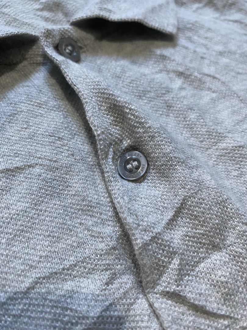 Fred Perry Grey Polo Shirt (Category: Tshirts & Polo Shirts ) located in Antipolo. Submitted by switchneighborhood (Listing ID 1470634404, Image 2). Description: - Brand: Fred Perry - Color: Grey - Material: 100% Cotton - Fit: Standard fit 22/28 measurement - Features: Classic collar, branded buttons, ribbed cuffs and hem - Logo: Iconic embroidered laurel wreath on chest - Care: Machine washable - Origin: Made in China.