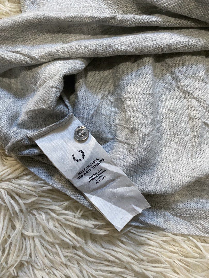 Fred Perry Grey Polo Shirt (Category: Tshirts & Polo Shirts ) located in Antipolo. Submitted by switchneighborhood (Listing ID 1470634404, Image 3). Description: - Brand: Fred Perry - Color: Grey - Material: 100% Cotton - Fit: Standard fit 22/28 measurement - Features: Classic collar, branded buttons, ribbed cuffs and hem - Logo: Iconic embroidered laurel wreath on chest - Care: Machine washable - Origin: Made in China.