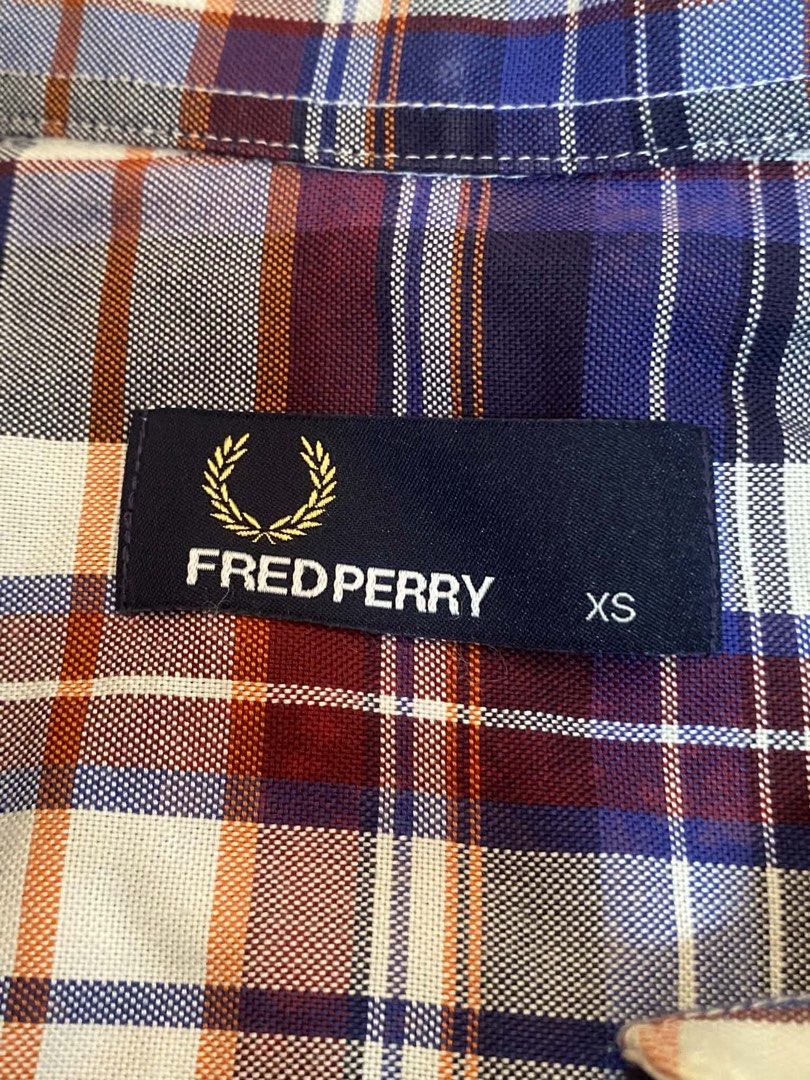 Fred Perry Plaid Short Sleeve Button Down Shirt Size XS (Category: Shirts) located in Manila. Submitted by judiec29 (Listing ID 1470599886, Image 1). Description: - Brand: Fred Perry - Style: Short sleeve button-down shirt - Pattern: Plaid (Blue, maroon, white, orange) - Size: XS - Features: Button-down collar, front button placket, single chest pocket with embroidered logo - Material: Lightweight cotton - Condition: Great casual wear.