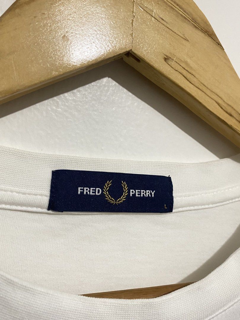 Fred Perry Script White Tee (Category: Tshirts & Polo Shirts ) located in Batangas. Submitted by got.thrift (Listing ID 1470575824, Image 2). Description: W-22 L-29 Like New No Issue.