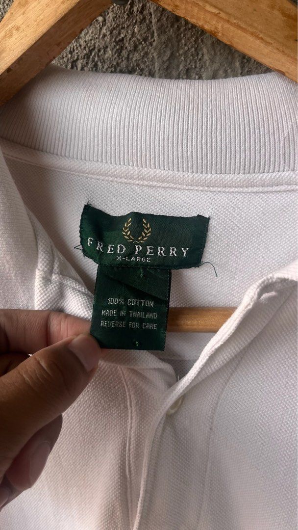Fred Perry White Polo Shirt (Category: Luxury Apparel) located in Cabuyao City. Submitted by kisyana (Listing ID 1470673628, Image 2). Description: .