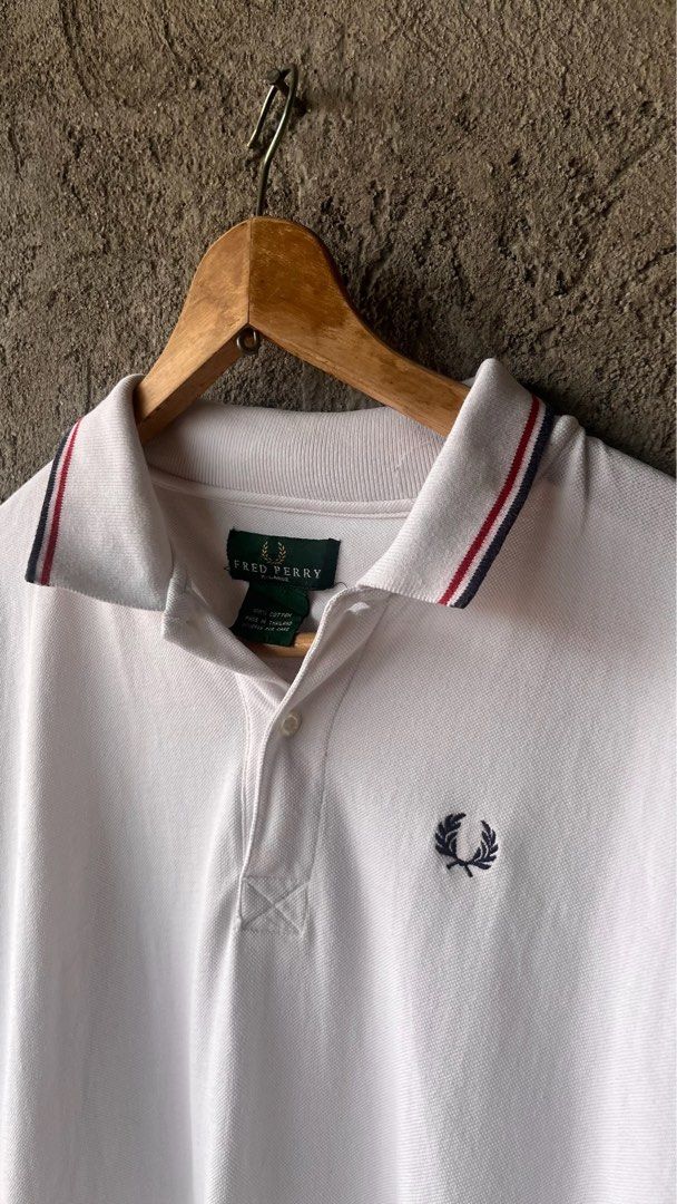 Fred Perry White Polo Shirt (Category: Luxury Apparel) located in Cabuyao City. Submitted by kisyana (Listing ID 1470673628, Image 3). Description: .