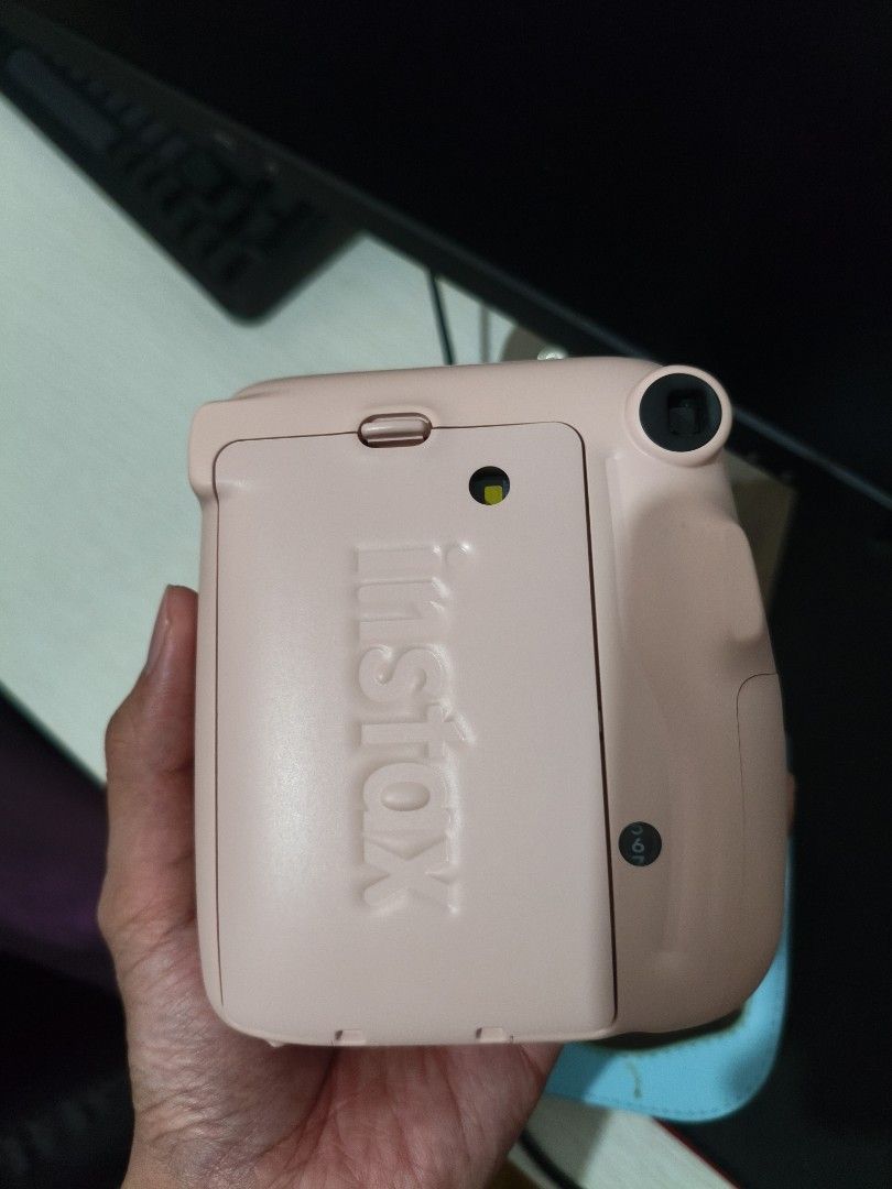 Fujifilm Instax Mini 11 Blush Pink with Case (Category: Cameras) located in Manila. Submitted by chanfinds (Listing ID 1470673084, Image 2). Description: - Item: Fujifilm Instax Mini 11 Instant Camera RFS: need funds - Color: Blush Pink - Inclusions: Light blue protective leather case with strap - Condition: Clean body, tested, and works - Note: has 6 films with case - Delivery (Lalamove/Grab) within Metro Manila - Mode of Payment: Cash or gcash.