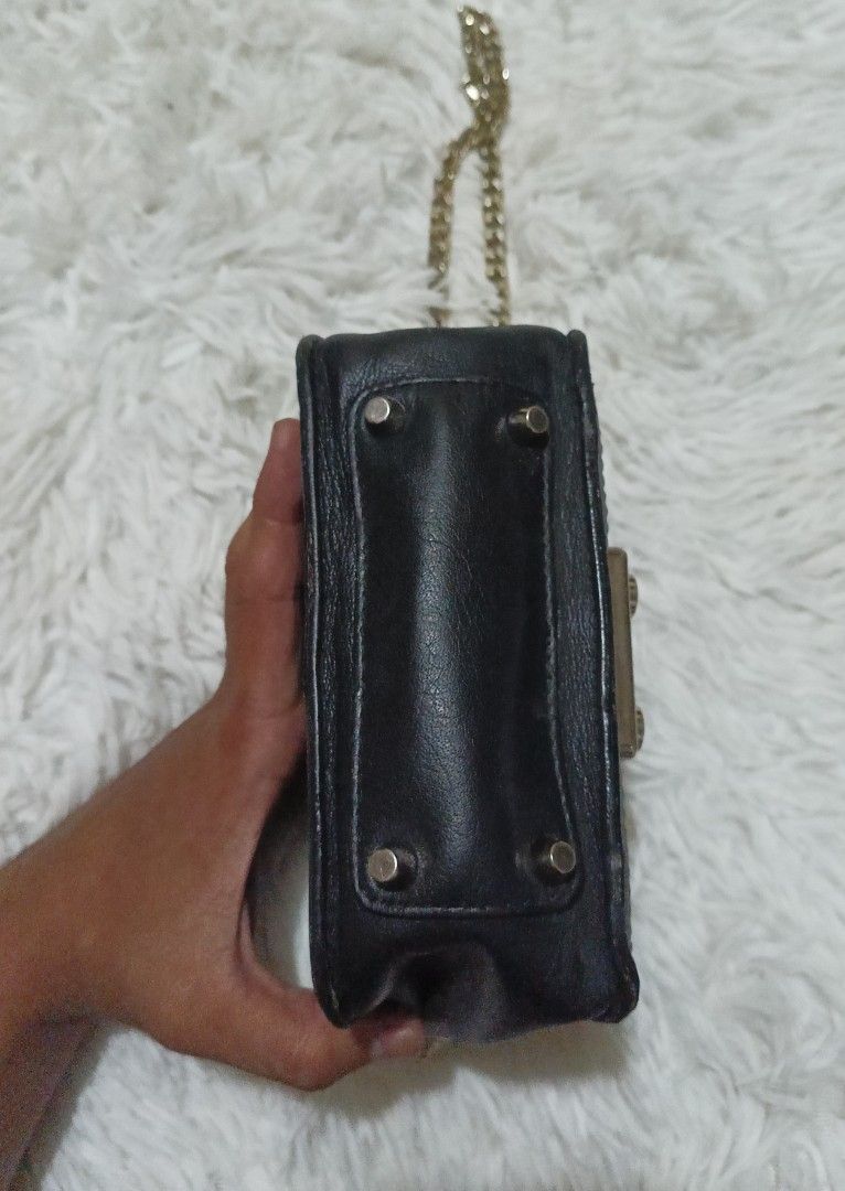 Furla multicolored leather chain crossbody bag (Category: Cross-body Bags) located in Quezon City. Submitted by lootsniwoah_12 (Listing ID 1470630833, Image 3). Description: - Brand: Furla - Material: Premium black leather with blue leather inserts - Hardware: Gold-tone accents and chain strap - Closure: Secure front flap with metallic turn-lock - Features: Textured gold-tone accent panel and protective metal feet on the base - Size: Compact, ide