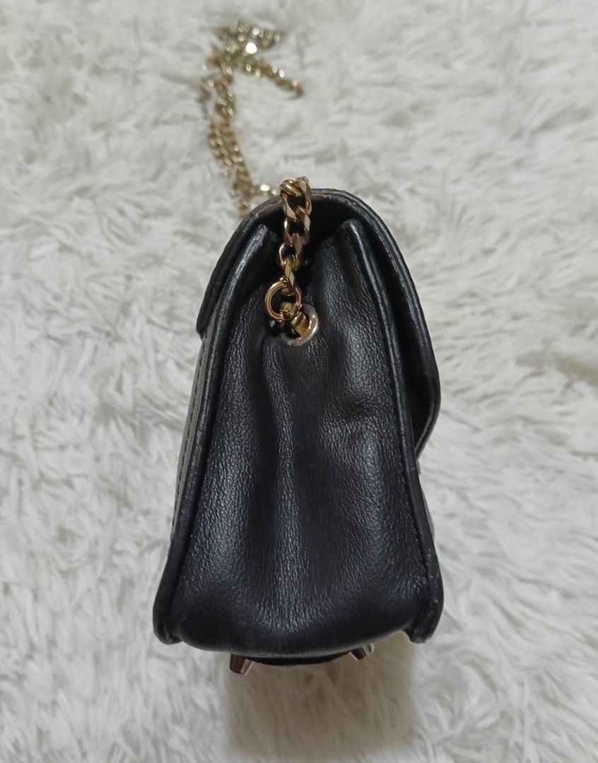 Furla multicolored leather chain crossbody bag (Category: Cross-body Bags) located in Quezon City. Submitted by lootsniwoah_12 (Listing ID 1470630833, Image 2). Description: - Brand: Furla - Material: Premium black leather with blue leather inserts - Hardware: Gold-tone accents and chain strap - Closure: Secure front flap with metallic turn-lock - Features: Textured gold-tone accent panel and protective metal feet on the base - Size: Compact, ide
