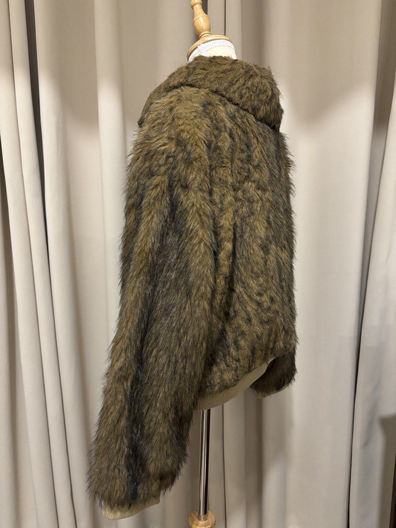 Fuzzy Brown Faux Fur Zip-Up Jacket (Category: Coats, Jackets and Outerwear) located in Makati City. Submitted by shopmycloset.ray (Listing ID 1470702451, Image 2). Description: - Brown animal print faux fur jacket - Full front zipper closure - Trendy wide collar detail - Ribbed hem and cuffs for a snug fit - Fluffy, warm, and statement-making texture - Ideal for colder weather or night outs.