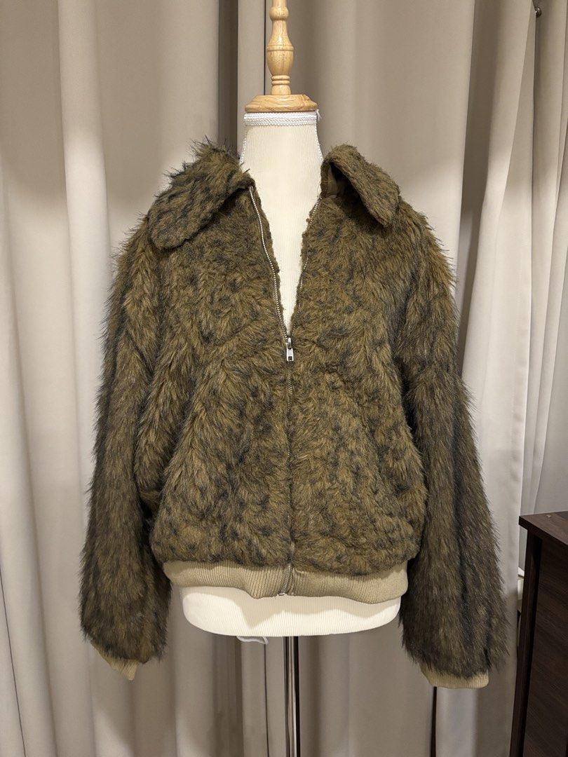 Fuzzy Brown Faux Fur Zip-Up Jacket (Category: Coats, Jackets and Outerwear) located in Makati City. Submitted by shopmycloset.ray (Listing ID 1470702451, Image 1). Description: - Brown animal print faux fur jacket - Full front zipper closure - Trendy wide collar detail - Ribbed hem and cuffs for a snug fit - Fluffy, warm, and statement-making texture - Ideal for colder weather or night outs.
