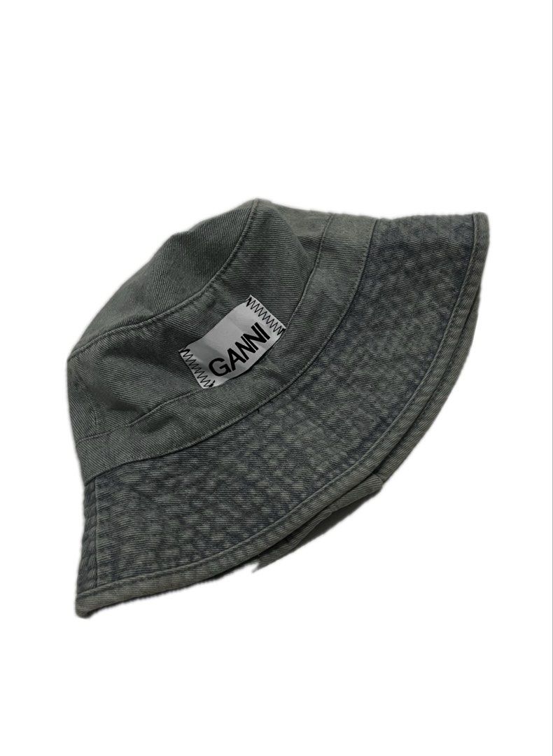 Ganni Denim Bucket Hat Grey (Category: Hats & Beanies) located in Tacloban City. Submitted by thrftg (Listing ID 1470651508, Image 1). Description: - Brand: Ganni - Style: Denim bucket hat - Color: Washed grey with contrasting white logo patch - Interior: Black fabric lining with official branded care tag - Perfect for: Casual everyday wear and streetwear styling - SF via J&T or GogoExpress / Same-day delivery available within Metro Manila.