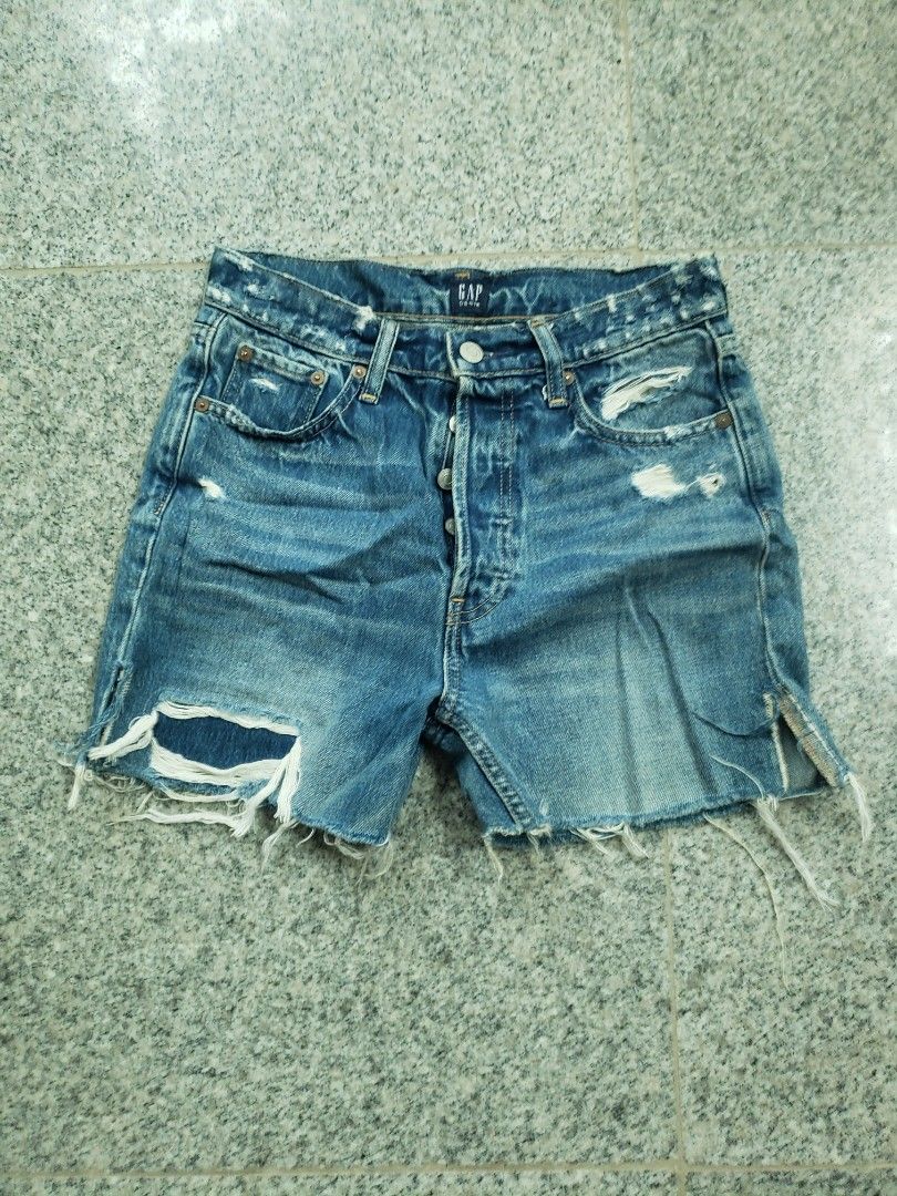 Gap Cheeky Straight Denim Shorts Medium Destroy Size 26 (Category: Shorts) located in Pagsanghan. Submitted by yuchinz (Listing ID 1470661345, Image 1). Description: - Brand/Style: Gap cheeky straight denim shorts - Wash: Medium destroy wash in solid blue - Size: 26 tall - Material: 100% cotton - Features: Classic button fly closure, raw frayed hem, and distressed details throughout - Care: Machine washable - Condition/Fit: Great casual staple pi