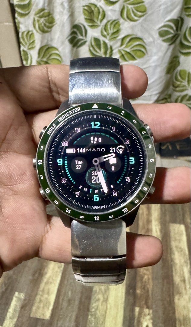 Garmin MARQ Golfer Gen 2 Smartwatch (Category: Wearables & Smart Watches) located in Quezon City. Submitted by angace13 (Listing ID 1470616463, Image 1). Description: - Model: Garmin MARQ Golfer Gen 2 GPS Smartwatch - Condition: Preowned, minor wear on the metal band and case back, screen works perfectly - Features: Green bezel with hole indicator markings - Inclusions: Metallic bracelet, extra green silicone strap, charging cable - Ideal for gol