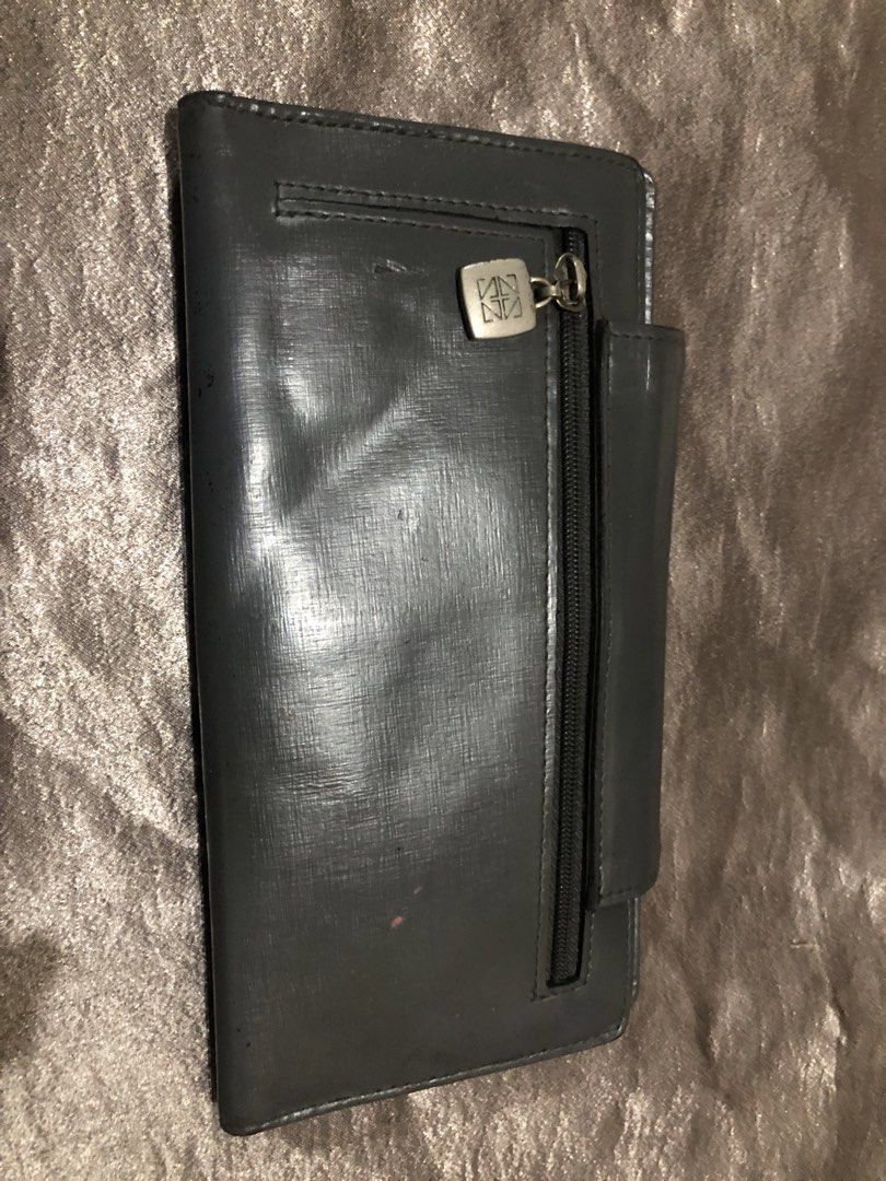 Gazzomani Dark Grey Long Wallet (Category: Wallets & Card holders) located in Valenzuela. Submitted by nixs2722 (Listing ID 1470705267, Image 3). Description: - Brand/Model: Gazzomani long wallet in dark grey - Finish: Textured with snap closure - Exterior: Metal hardware plate on front with visible scratches and wear; back zip pocket with a custom zip pull - Interior: Multiple card slots and an ID window - Condition: Used with noticeable signs o