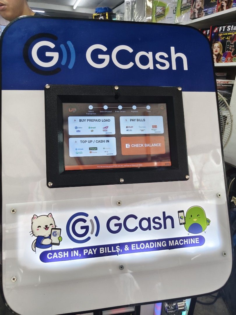 GCash Cash-In Pay Bills and E-Loading Machine Kiosk (Category: Office & Business Technology) located in Manila. Submitted by engrkkkk (Listing ID 1470641281, Image 2). Description: - All-in-one business machine for GCash, PayMaya, and e-loading - Supports bill payments for Smart, Globe, Sun, PLDT, Cignal, Sky, and more - Equipped with a touchscreen monitor, bill acceptor, and coin slots - Comes with fully functional signage and body graphics - Pe