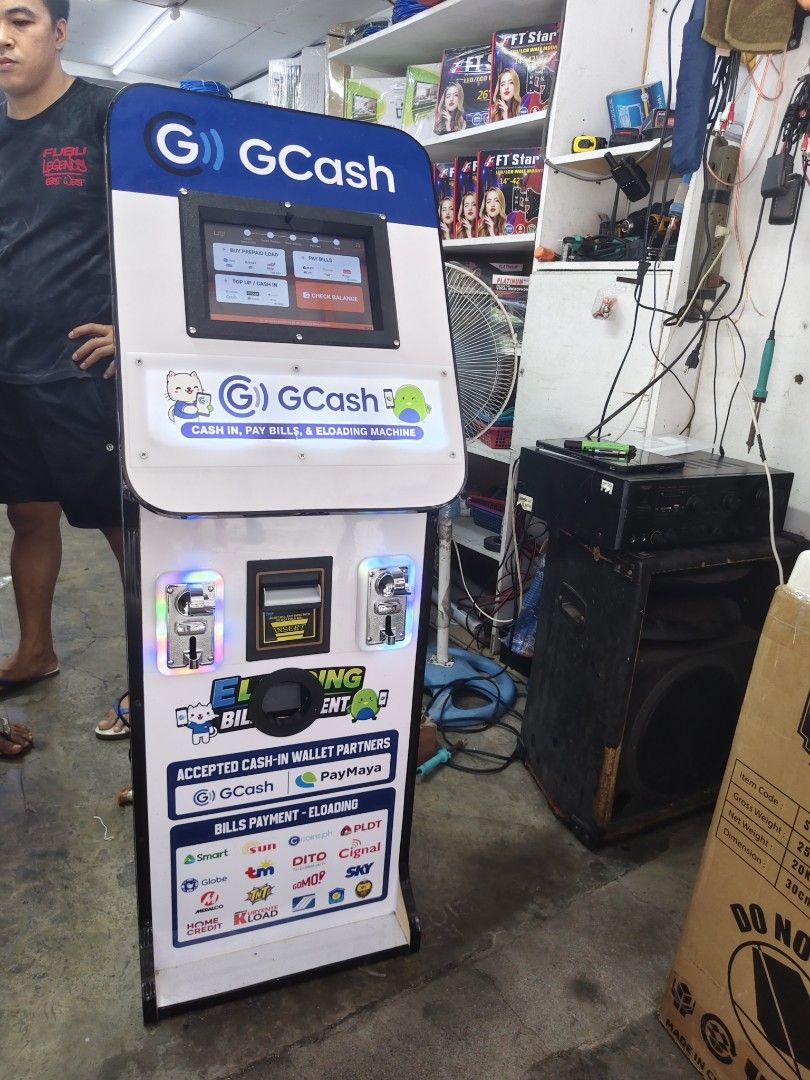 GCash Cash-In Pay Bills and E-Loading Machine Kiosk (Category: Office & Business Technology) located in Manila. Submitted by engrkkkk (Listing ID 1470641281, Image 1). Description: - All-in-one business machine for GCash, PayMaya, and e-loading - Supports bill payments for Smart, Globe, Sun, PLDT, Cignal, Sky, and more - Equipped with a touchscreen monitor, bill acceptor, and coin slots - Comes with fully functional signage and body graphics - Pe