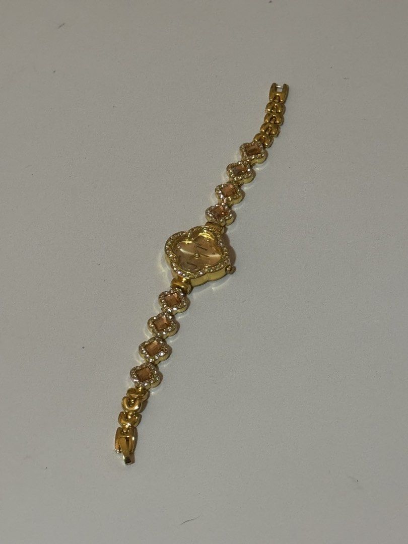 clover rhinestone gold quartz watch (Category: Women's Watches) located in Manila. Submitted by belle2005 (Listing ID 1470671664, Image 1). Description: Watch Closure: Buckle • Watch Style: Fashion • Strap Material: Metal Dial Face: Analog • Cae Material:e Alloy • Dial Window Material:Hardlex Glass - Condition: Excellent / Ready to wear - Perfect for daily wear or special occasions - not 100% real gold - bought it in a school bazaar and never bee