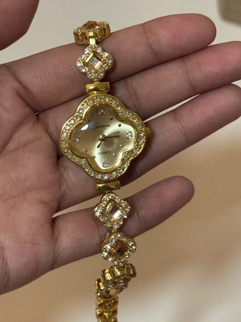 clover rhinestone gold quartz watch (Category: Women's Watches) located in Manila. Submitted by belle2005 (Listing ID 1470671664, Image 3). Description: Watch Closure: Buckle • Watch Style: Fashion • Strap Material: Metal Dial Face: Analog • Cae Material:e Alloy • Dial Window Material:Hardlex Glass - Condition: Excellent / Ready to wear - Perfect for daily wear or special occasions - not 100% real gold - bought it in a school bazaar and never bee