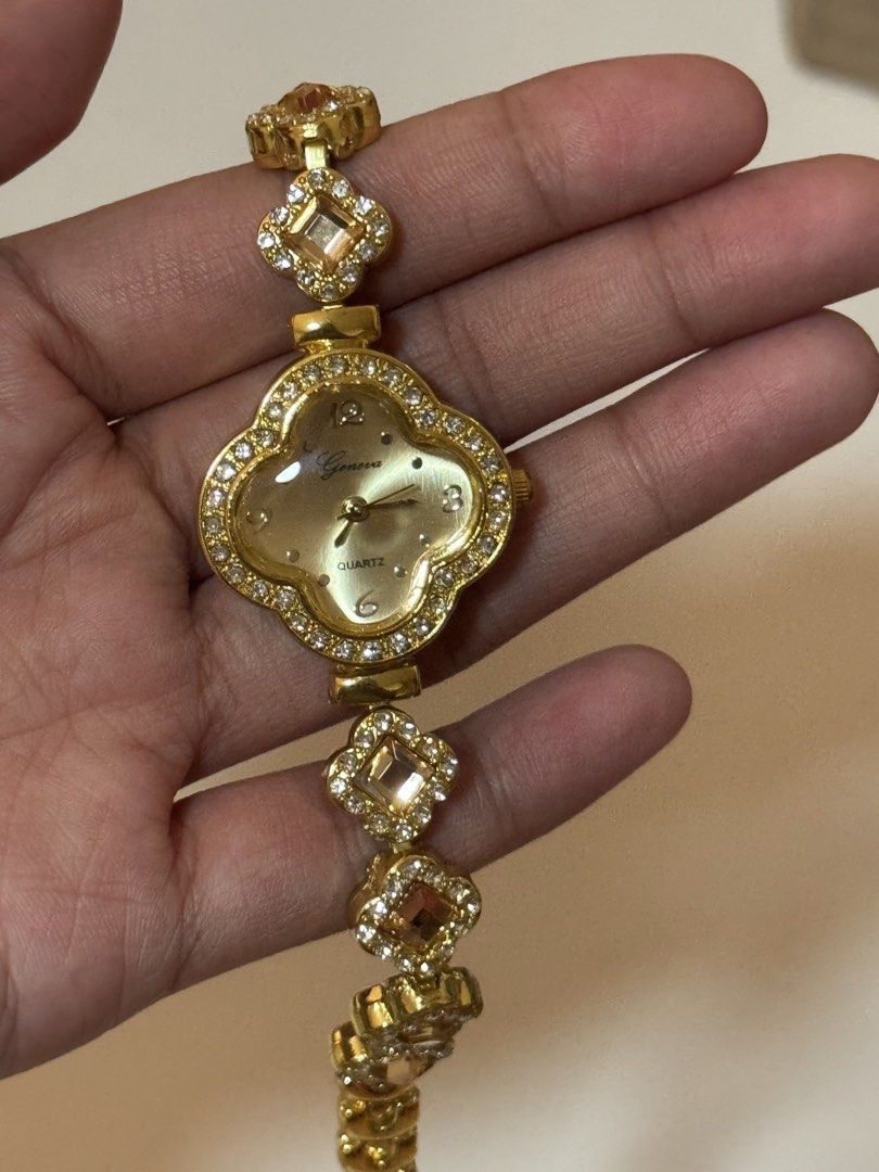 clover rhinestone gold quartz watch (Category: Women's Watches) located in Manila. Submitted by belle2005 (Listing ID 1470671664, Image 2). Description: Watch Closure: Buckle • Watch Style: Fashion • Strap Material: Metal Dial Face: Analog • Cae Material:e Alloy • Dial Window Material:Hardlex Glass - Condition: Excellent / Ready to wear - Perfect for daily wear or special occasions - not 100% real gold - bought it in a school bazaar and never bee