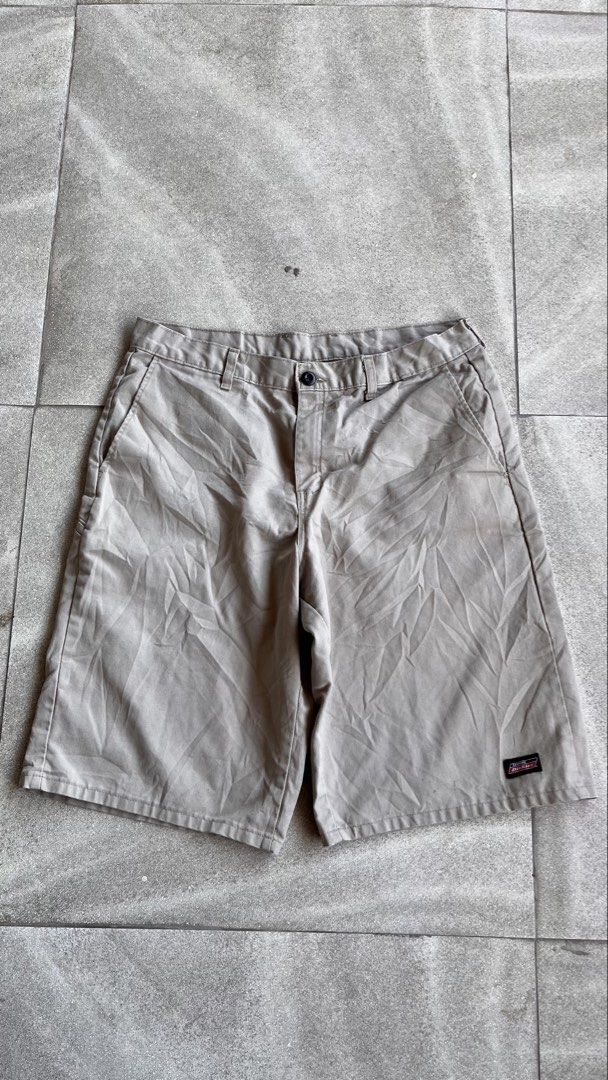 Genuine Dickies Khaki Cargo Shorts Size 34 (Category: Shorts) located in Cabuyao City. Submitted by bulandos (Listing ID 1470655039, Image 2). Description: - Brand: Genuine Dickies - Size: 34 - Color: Khaki / Solid neutral - Material: 65% polyester, 35% cotton (durable and comfortable) - Features: Back welt pockets, side utility pocket, and woven Dickies logo patches - Care: Machine washable - Condition: Great for everyday casual wear.