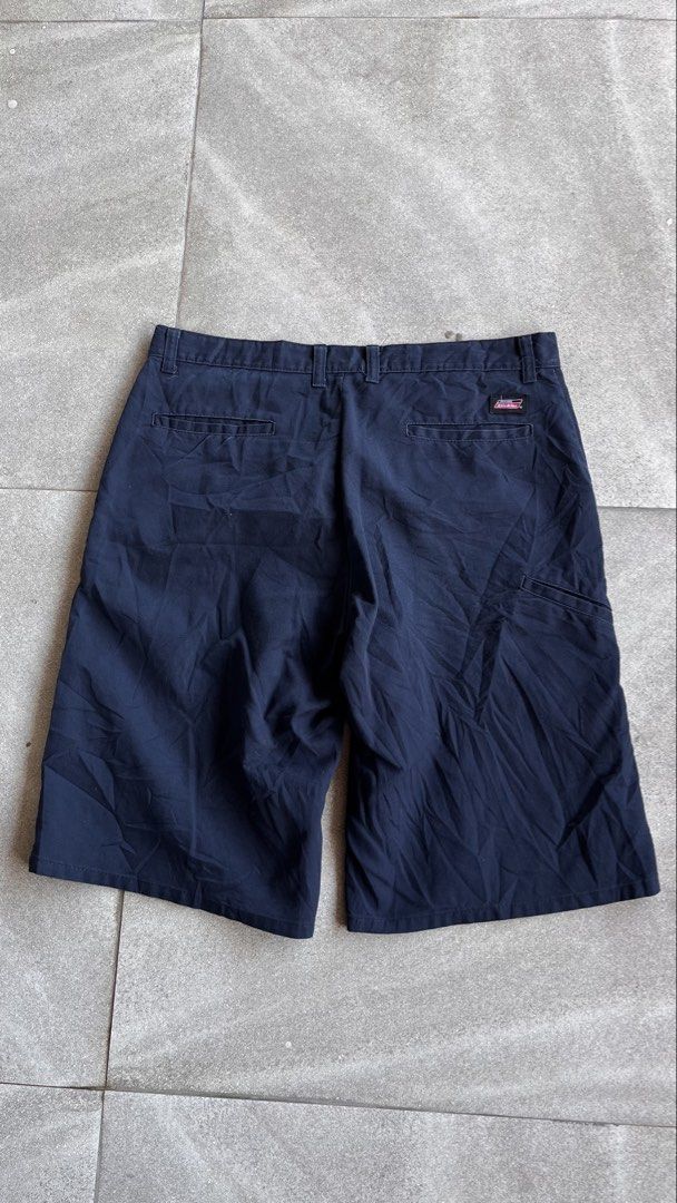 Genuine Dickies Navy Blue Work Shorts (Category: Shorts) located in Cabuyao City. Submitted by bulandos (Listing ID 1470655132, Image 2). Description: Genuine Dickies navy blue utility shorts. Classic workwear style with multi-pocket design including back welt pockets and side tool pocket. Iconic Dickies logo patch above the back right pocket. Button closure with zip fly and belt loops. Durable cotton blend fabric, great for daily casual wear or 