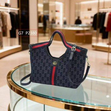 GG Denim Blue Giglio small (Category: Tote Bags) located in Quezon City. Submitted by arwenpasion (Listing ID 1470569434, Image 1). Description: - Giglio denim blue tote bag with classic GG monogram pattern - Features the signature red and blue web stripe down the center - Equipped with double top handles and an adjustable shoulder strap (still in plastic packaging) - Elegant gold-tone hardware with interlocking G logo - Light-colored fabric lini