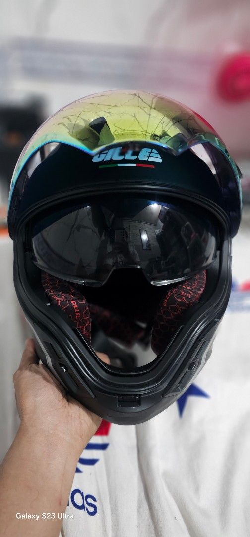 Gille Phoenix Helmet Matte Black (Category: Caps & Hats) located in Tarlac. Submitted by chiefnaticz2020 (Listing ID 1470656757, Image 2). Description: - Brand: Gille Motorcycle Helmet INCLUSIONS: BOX ✅️ FREE CLEAR LENS✅️ Free cover cloth✅️ - Color: Matte Black with eye-catching iridescent rainbow visor - Visor: Includes an additional inner sun visor for day and night riding - Interior: Comfortable red and black honeycomb patterned inner padding 