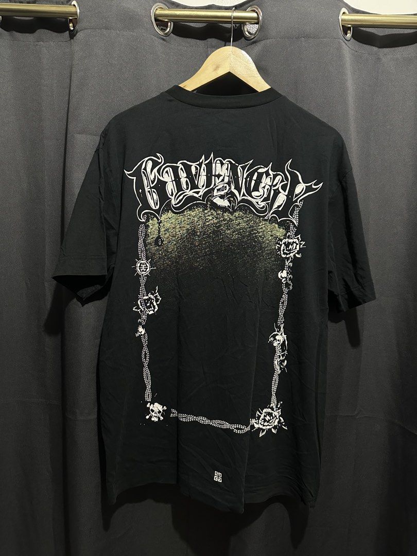 Givenchy Gothic Lettering & Floral Frame Graphic Tee (Category: Tshirts & Polo Shirts ) located in Buenavista. Submitted by themodernrack (Listing ID 1470595243, Image 2). Description: Condition: Good Condition (minimal hairlines and repaired very small pinhole) Measurements & Sizing: Size: Tagged Size XL (Givenchy oversized boxy fit; fits like Men’s XL/XXL) Width (Pit to Pit): 23” Length: 28”.