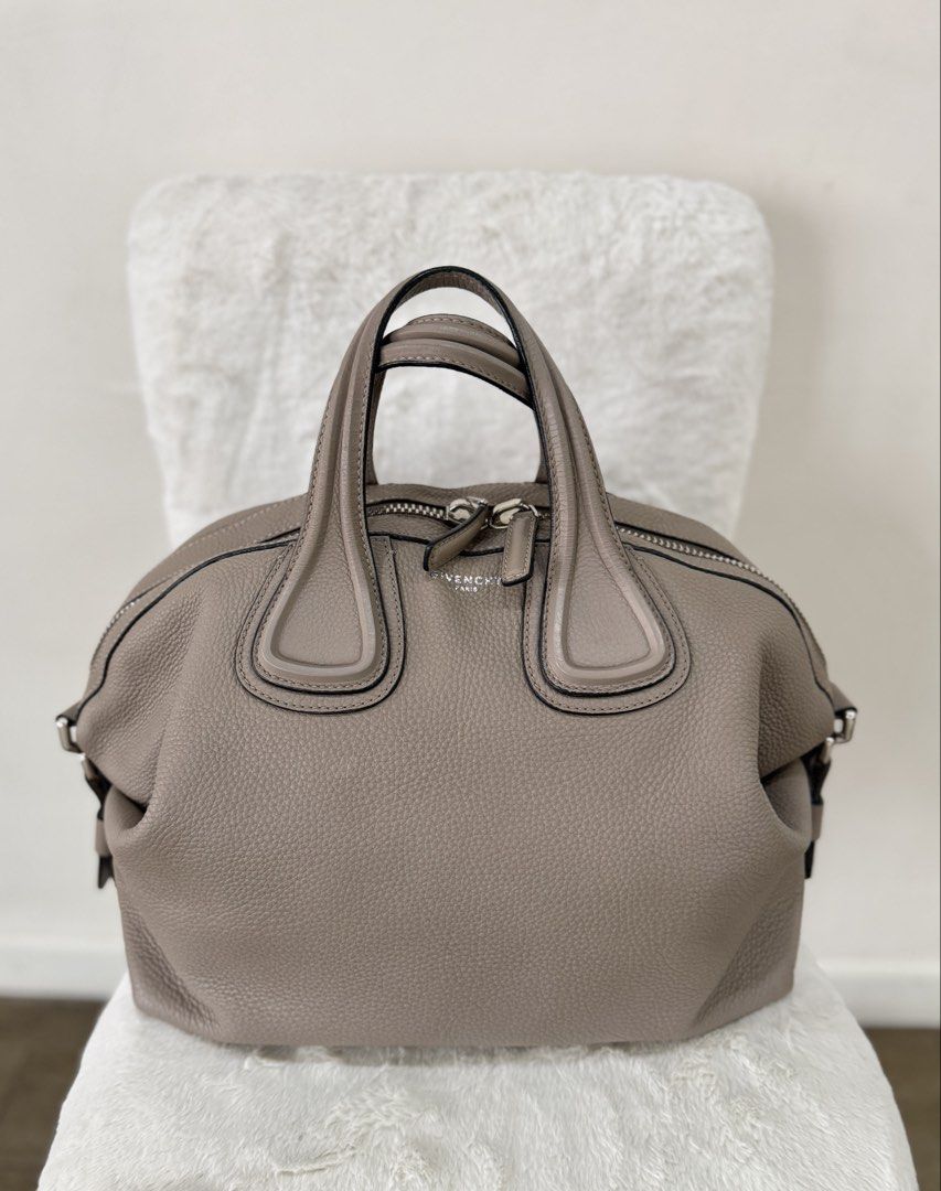 Givenchy Nightingale Large in Mastic (Category: Luxury Bags & Wallets) located in Quezon City. Submitted by closet24 (Listing ID 1470584071, Image 3). Description: - Brand: Givenchy - Material: Mastic pebbled leather - Hardware: Silver-tone with subtle front logo - Closure: Zip top - Handles: Dual rolled top handles - Features: Structured slouchy silhouette with side strap details - Condition: Very well-maintained, clean interior and exterior - V