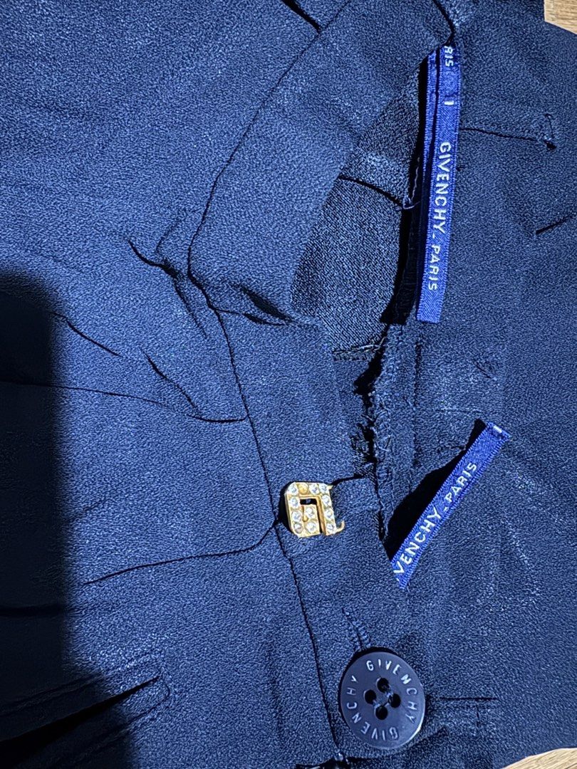 Givenchy Paris Navy Trousers (Category: Other Bottoms) located in Muntinlupa City. Submitted by jane226ph (Listing ID 1470716251, Image 3). Description: An authentic 1990s Givenchy womenswear trousers from the Givenchy Boutiques ready to wear line. Color Navy Blue Waist line is 22” Original main Givenchy label is no longer attached. But the piece retains its Givenchy branded button, rhinestone “G” hardware, hanger straps. Made in France. Sold as-