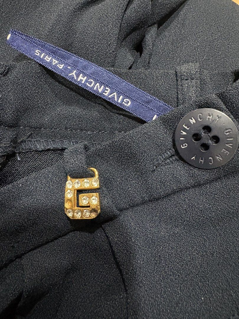 Givenchy Paris Navy Trousers (Category: Other Bottoms) located in Muntinlupa City. Submitted by jane226ph (Listing ID 1470716251, Image 2). Description: An authentic 1990s Givenchy womenswear trousers from the Givenchy Boutiques ready to wear line. Color Navy Blue Waist line is 22” Original main Givenchy label is no longer attached. But the piece retains its Givenchy branded button, rhinestone “G” hardware, hanger straps. Made in France. Sold as-