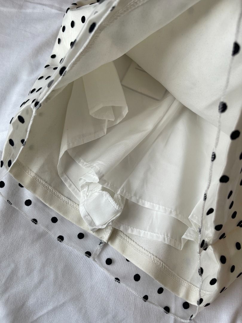 Glam White Polka Skirt (Category: Skirts) located in Quezon City. Submitted by everythingmustgo__ (Listing ID 1470669928, Image 2). Description: Glam White Polka Skirt (from BKK 🇹🇭) - brand new with tags - size: small (waist 25-26) - with built-in shorts - super nice quality! ‼️ firm with price. low ballers will not be entertained ‼️ .