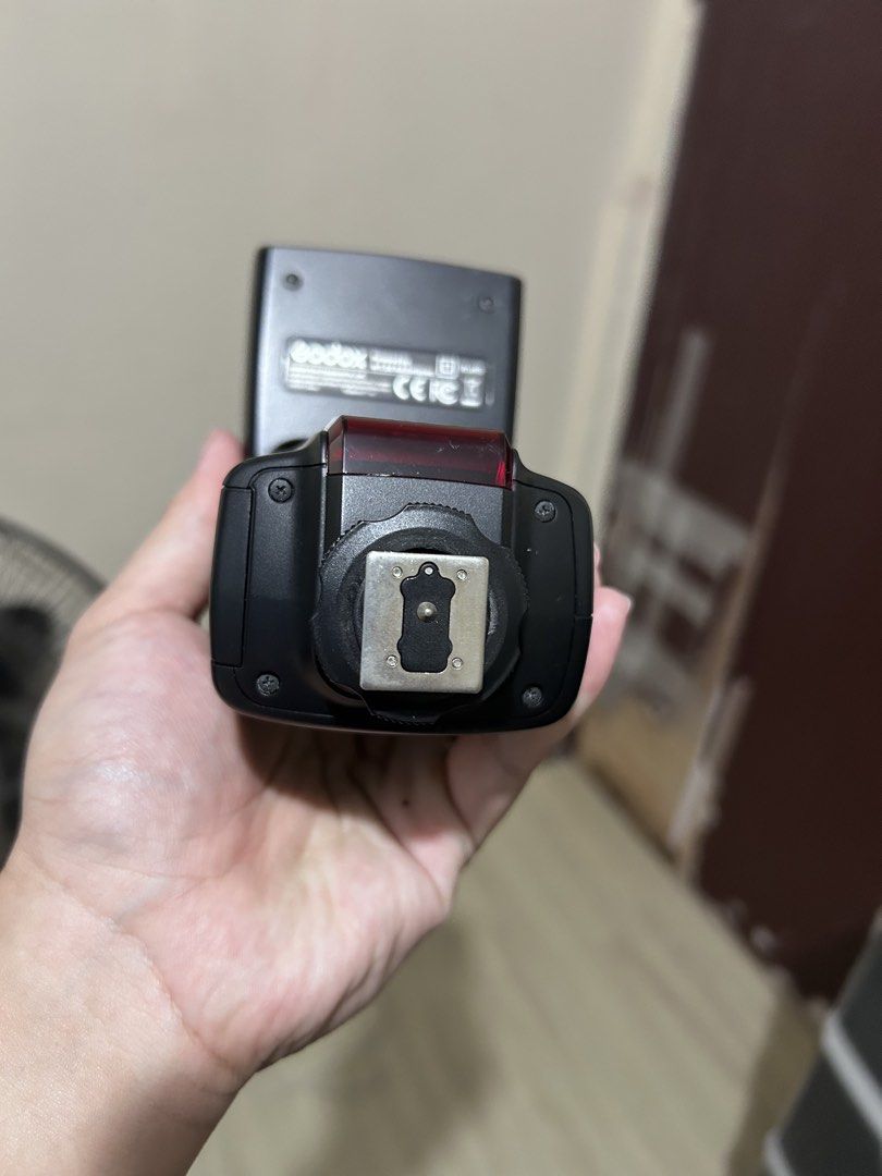 Godox Camera Speedlite Flash (Category: Flashes) located in Manila. Submitted by franciskok29983 (Listing ID 1470565309, Image 2). Description: - Brand: Godox/TT520 II - Color: Black housing - Mount: Standard hot shoe mount with standard pin configuration - Condition: Fully functional and tested - Features: Front flash head and red panel - Compatibility: Works with standard camera hot shoe setups RFS: Di na nagagamit Meetup: South cembo or BGC.