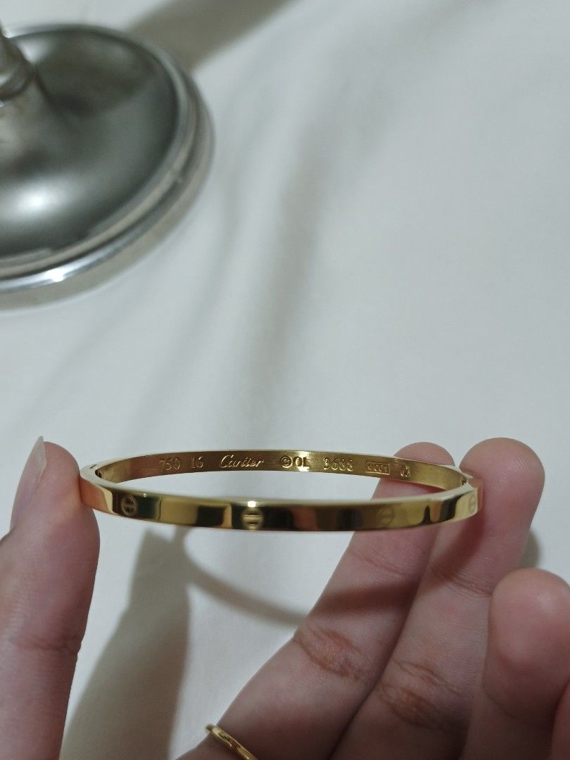 Gold-Tone Cartier Bangle and Ring Set (Category: Body Jewelry) located in Cavite. Submitted by candielps (Listing ID 1470587773, Image 3). Description: Authenticity not guaranteed.