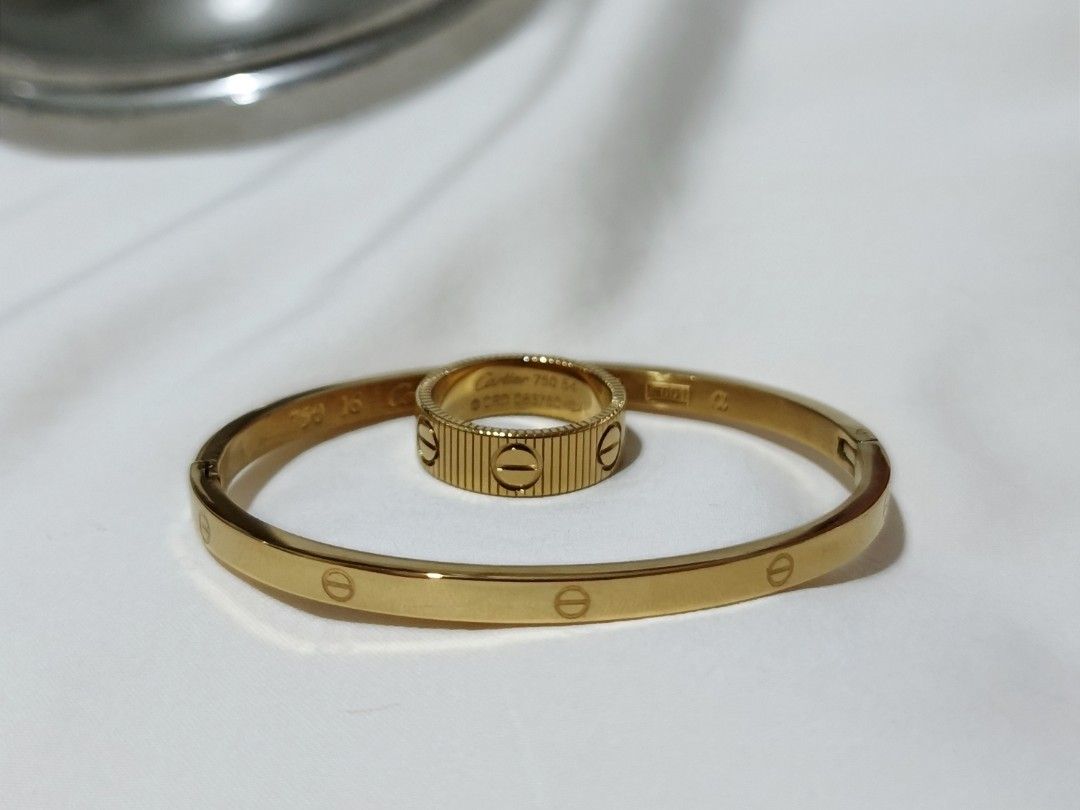 Gold-Tone Cartier Bangle and Ring Set (Category: Body Jewelry) located in Cavite. Submitted by candielps (Listing ID 1470587773, Image 1). Description: Authenticity not guaranteed.