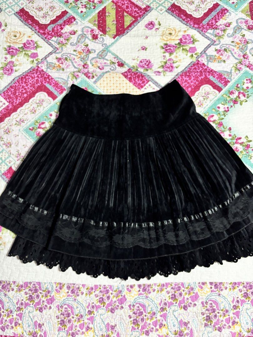 Gothic skirt (Category: Skirts) located in Sual. Submitted by cinnamorol_lovar (Listing ID 1470624550, Image 1). Description: - Color: Black - Material: Soft velvet with delicate lace trim - Design: All-around pleats, layered look, and scalloped bottom hem - Waistband: Wide, smooth waistband for a flattering fit - Styling: Perfect to pair with boots and tights for cooler weather - Condition: Excellent pre-loved condition (ready to wear).