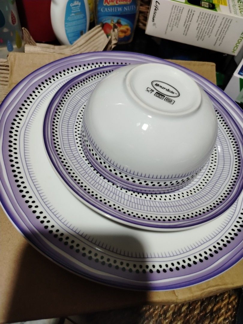 Gourdo's Purple Pattern Dinner Plates Bowl and Mug Set (Category: Dinnerware & Cutlery) located in Quezon City. Submitted by shewool (Listing ID 1470591148, Image 2). Description: Matching dinnerware set from Gourdo's. Includes large plates, smaller plates, a deep bowl, and a mug with a handle. Purple and black patterned trim design on white ceramic. Microwave and dishwasher safe symbols printed on the bottom bases. Great for daily meals or hosti