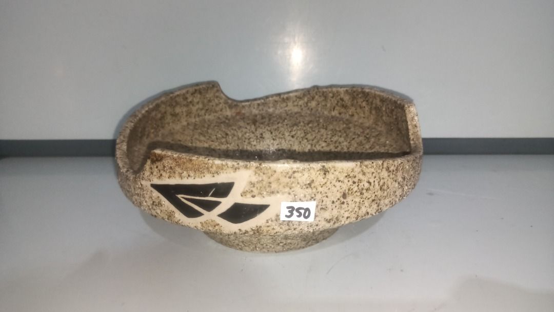 Granite texture Ikebana ceramic bonsai pot with drainage base (Category: Pots & Planters) located in Munoz. Submitted by larryc1212 (Listing ID 1470632921, Image 2). Description: - Material: Textured ceramic with grainy stone finish - Design: Cream and grey speckled pattern with leaf cutouts along the upper rim - Dimensions: Approx. 8 inches across x 3.5 inches tall - Features: Sturdy base ring and clean interior - Ideal for: Succulents, small bo