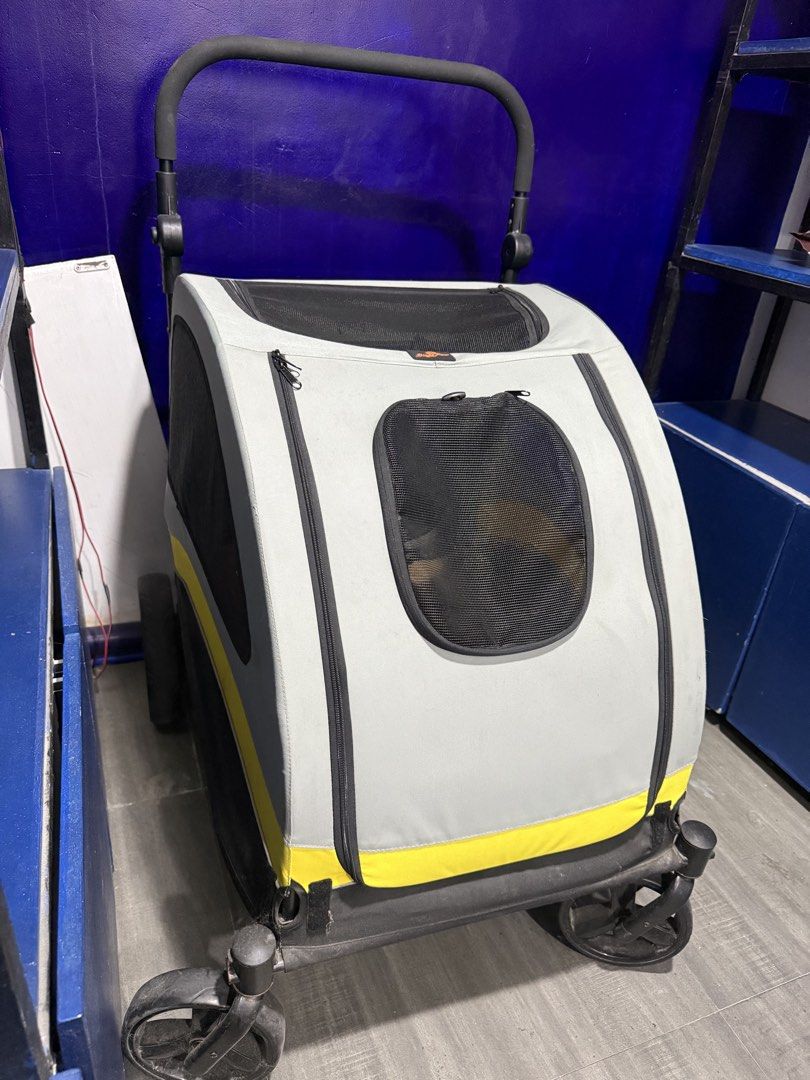 Gray and Yellow Pet Stroller with Mesh Windows (Category: Homes & Other Pet Accessories) located in Quezon City. Submitted by truewhale.5f8ec0 (Listing ID 1470636235, Image 1). Description: Gray pet stroller with bright yellow trim along the base. Multiple mesh panels provide ventilation and views for pets. Large front zipper opening plus smaller window flap. Sturdy wheels and adjustable padded handlebar. Black interior floor liner included..