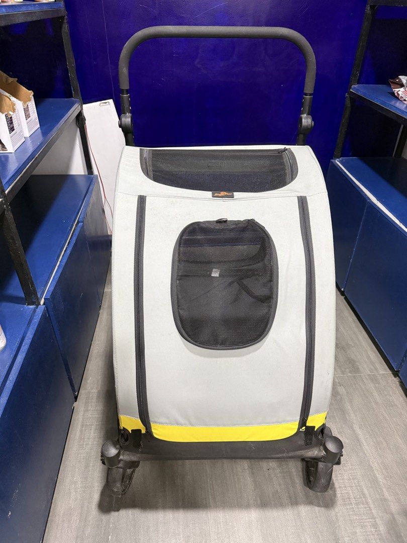 Gray and Yellow Pet Stroller with Mesh Windows (Category: Homes & Other Pet Accessories) located in Quezon City. Submitted by truewhale.5f8ec0 (Listing ID 1470636235, Image 3). Description: Gray pet stroller with bright yellow trim along the base. Multiple mesh panels provide ventilation and views for pets. Large front zipper opening plus smaller window flap. Sturdy wheels and adjustable padded handlebar. Black interior floor liner included..