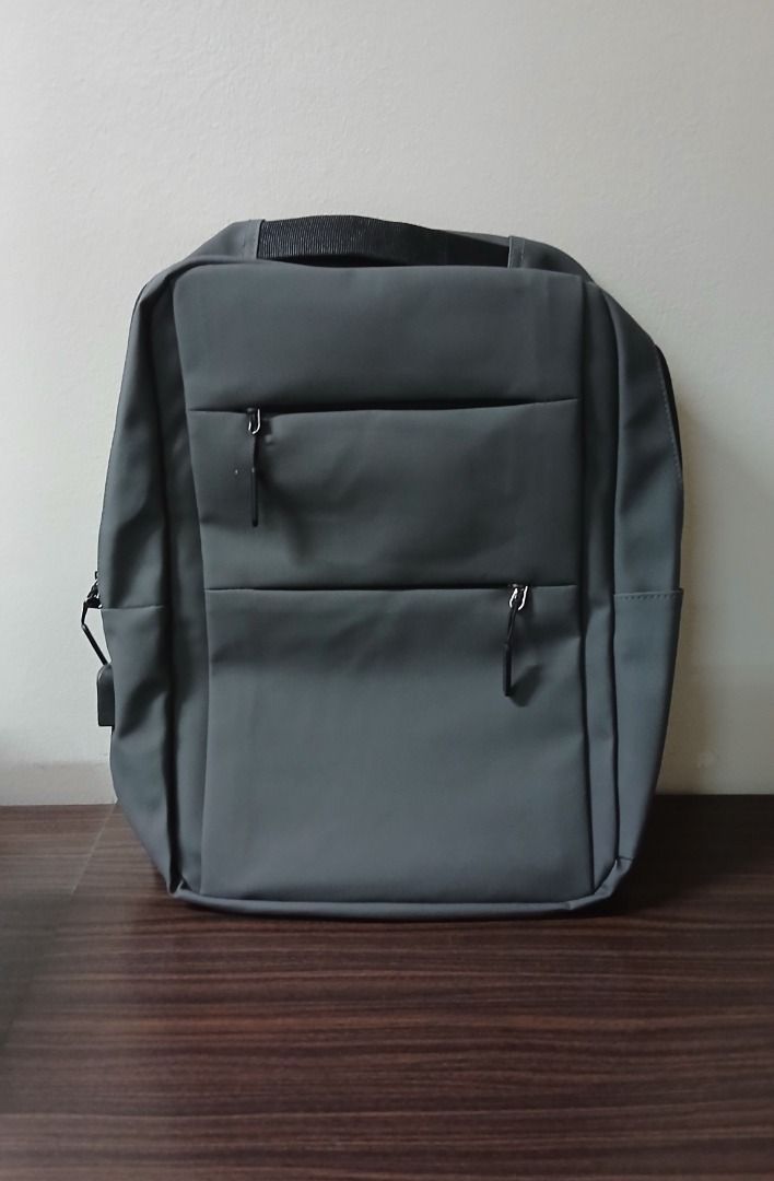 Gray Backpack Simple Casual Bag with Mini Pouch Bag (Category: Backpacks) located in Manila. Submitted by townlites (Listing ID 1470567212, Image 2). Description: Color: Gray Size: 40 x 10 x 29 cm Closure type: zipper With mini pouch bag With USB hole design Fashion bag Backpack style Brand new Quality product.