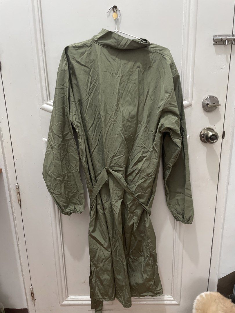 Green Raincoat Trench Coat with Belt (Category: Coats, Jackets and Outerwear) located in Cainta. Submitted by nancygoreng (Listing ID 1470624908, Image 2). Description: - Color: Army green - Style: Mid-length with a matching fabric tie belt - Closure: Button-up front with a high collar - Cuffs: Elastic on both sleeves - Material: Lightweight and easy to fold/pack - Design: Simple solid color.