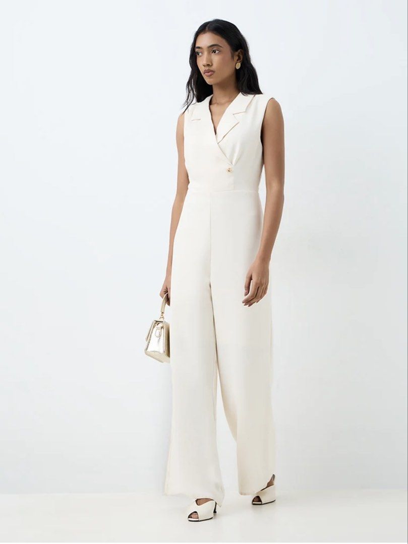 GRL Beige Sleeveless Blazer Jumpsuit (Category: Jumpsuits) located in Cavite. Submitted by yakultjeni85475 (Listing ID 1470677935, Image 1). Description: - Color: Elegant beige - Style: Sleepless jumpsuit with lapel collar and double-breasted button front - Fit: Tailored look with a wide-leg cut - Condition: Worn once for a brief indoor event, stored properly - Flaws: Zero stains, no loose threads.