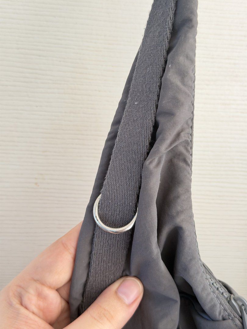 GU gray shoulder bag (Category: Shoulder Bags) located in Manila. Submitted by cinnmoroll (Listing ID 1470608382, Image 3). Description: - Brand: GU - Style: Slouchy hobo shoulder bag / everyday carryall - Color: Dark gray - Closure: Secure top zipper - Features: Roomy interior compartment and adjustable strap with metal hardware - Condition: Good, with minimal rusting on the hardware rings.