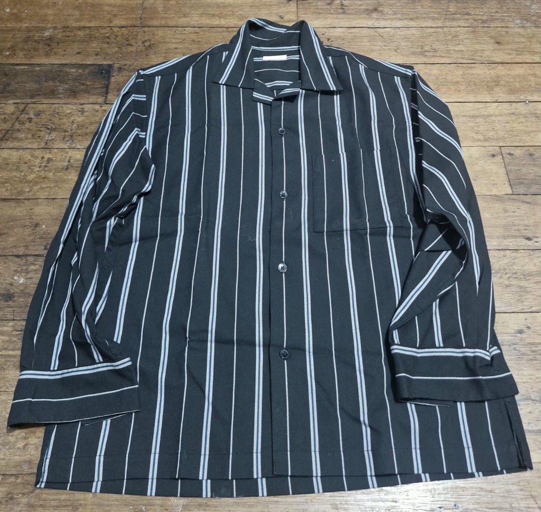 GU Long Sleeve Shirt Striped Button Down (Category: Tshirts & Polo Shirts ) located in Manila. Submitted by blackstarharpoon (Listing ID 1470583940, Image 1). Description: - Color: Black with vertical light blue stripes - Fit: Relaxed fit, great for solo wear or layering - Details: Camp collar, long sleeves with cuffs, and a single left chest pocket - Closure: Standard front button closure with a clean hem - Material: Lightweight and breathable f