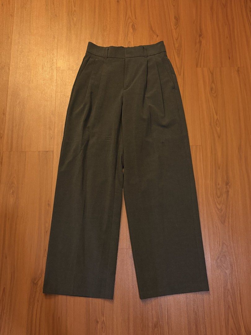 GU Pleated Wide Leg Pants Dark Grey Size M (Category: Other Bottoms) located in Manila. Submitted by preloved123. (Listing ID 1470716640, Image 1). Description: - Brand/Model: GU Dark Grey Trousers - Fit: Wide leg cut with high rise waist and elastic back band - Details: Front pleats, clean condition inside and out - Material: 67% polyester, 30% rayon, 3% spandex - Size: Medium (fits 66cm waist per tag).