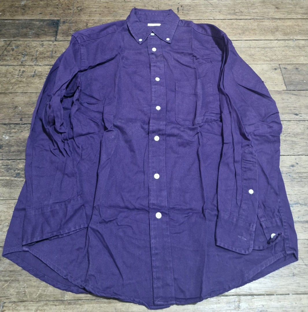 GU Purple button-down long sleeve shirt (Category: Tshirts & Polo Shirts ) located in Manila. Submitted by blackstarharpoon (Listing ID 1470583714, Image 1). Description: - Color: Deep purple - Style: Long sleeve button-down shirt with a classic collar - Details: Front chest pocket, white buttons, and adjustable cuffs - Hem: Curved hem - Fit: Standard fit - Material: Comfortable cotton or cotton-blend fabric - Versatility: Great staple piece for 