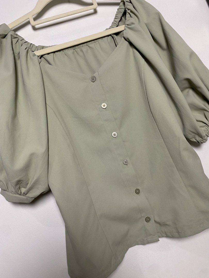 GU Sage green puff sleeve blouse (Category: Blouses) located in Makati City. Submitted by indaysukaycloset (Listing ID 1470683282, Image 2). Description: 🌿 GU SAGE PUFF BLOUSE FOR SALE ITEM: Sage Green Puff Sleeve Blouse BRAND: GU by UNIQLO - Japan Brand COLOR: Sage / Matcha Green - super trendy! STYLE: Square Neck / Puff Sleeve TAG SIZE: M FITS: Medium to large FABRIC: 100% Polyester (ポリエステル) → Flowy, light, soft, no wrinkle, not mainit FEATURE