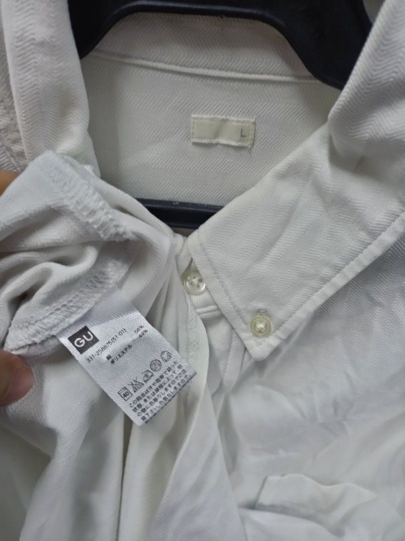 GU white long sleeve button-up shirt size L (Category: Longsleeves) located in Bayombong. Submitted by rheaaa00530 (Listing ID 1470671201, Image 2). Description: - Brand: GU - Color: Solid White - Size: L - Style: Long-sleeve, button-down collar, standard front button closure - Features: Single pocket on the left chest - Material: 56% cotton, 44% polyester blend - Condition: Versatile basic that goes with everything.