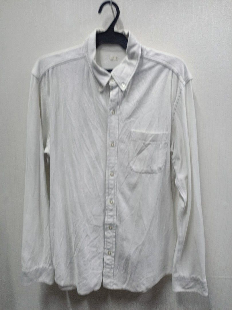 GU white long sleeve button-up shirt size L (Category: Longsleeves) located in Bayombong. Submitted by rheaaa00530 (Listing ID 1470671201, Image 1). Description: - Brand: GU - Color: Solid White - Size: L - Style: Long-sleeve, button-down collar, standard front button closure - Features: Single pocket on the left chest - Material: 56% cotton, 44% polyester blend - Condition: Versatile basic that goes with everything.
