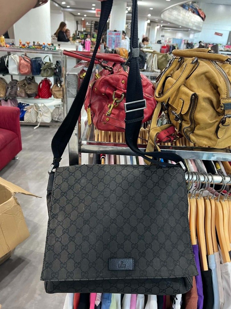 Gucci GG Monogram Canvas Messenger Bag Black (Category: Luxury Bags & Wallets) located in Urdaneta. Submitted by jayceegarage (Listing ID 1470693116, Image 1). Description: - Authentic Gucci messenger bag in classic black GG monogram canvas - Flap front design with secure magnetic closure and small leather logo patch - Adjustable black fabric shoulder strap for comfortable crossbody wear - Handy exterior slip pocket on the back for easy access - 