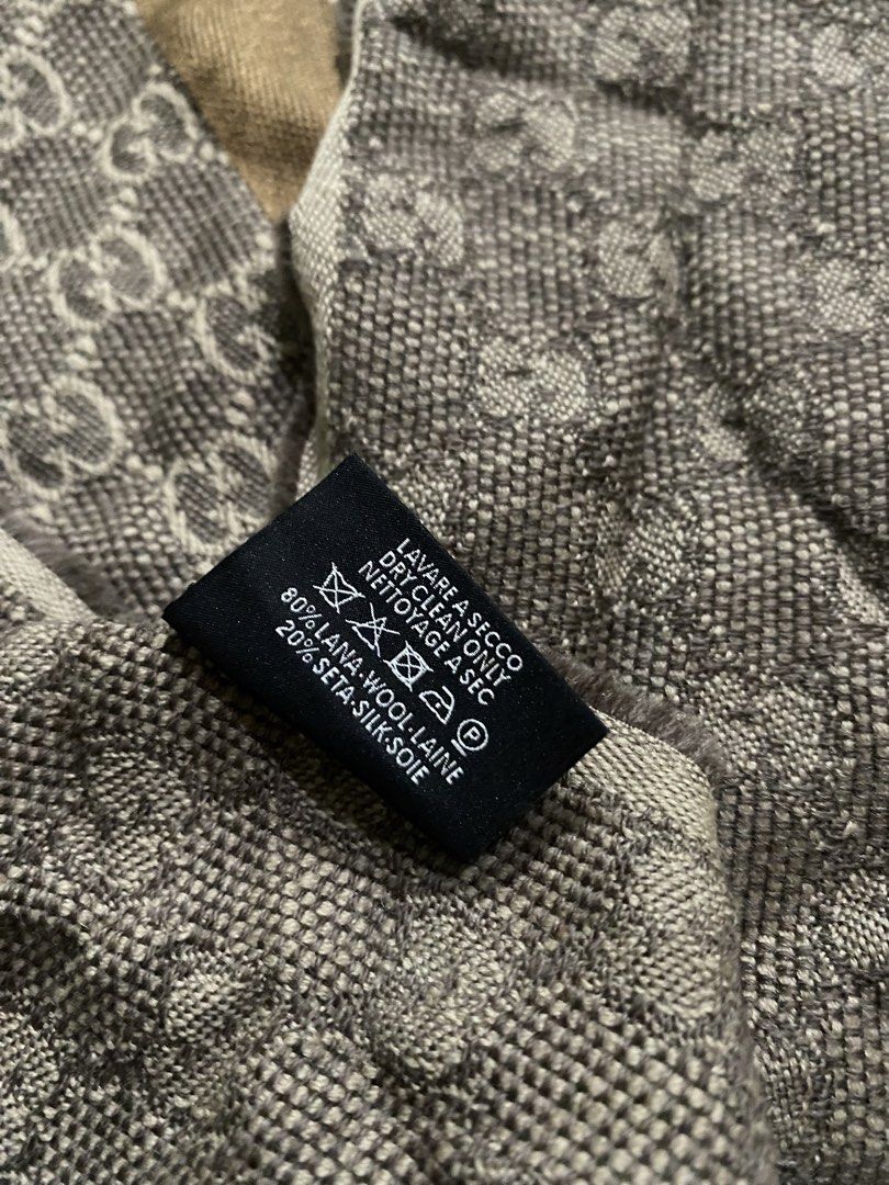 Gucci GG Monogram Wool Silk Scarf Brown (Category: Scarves) located in Pozorrubio. Submitted by izaykite2g (Listing ID 1470682941, Image 3). Description: - Authentic classic Gucci monogram scarf in brown and cream tones - 14 inches x 69 inches - Features the iconic GG pattern with stylish striped borders and fringed edges - Luxurious 80% wool and 20% silk blend for warmth and comfort - Dry clean only - Perfect accessory for cooler weather.