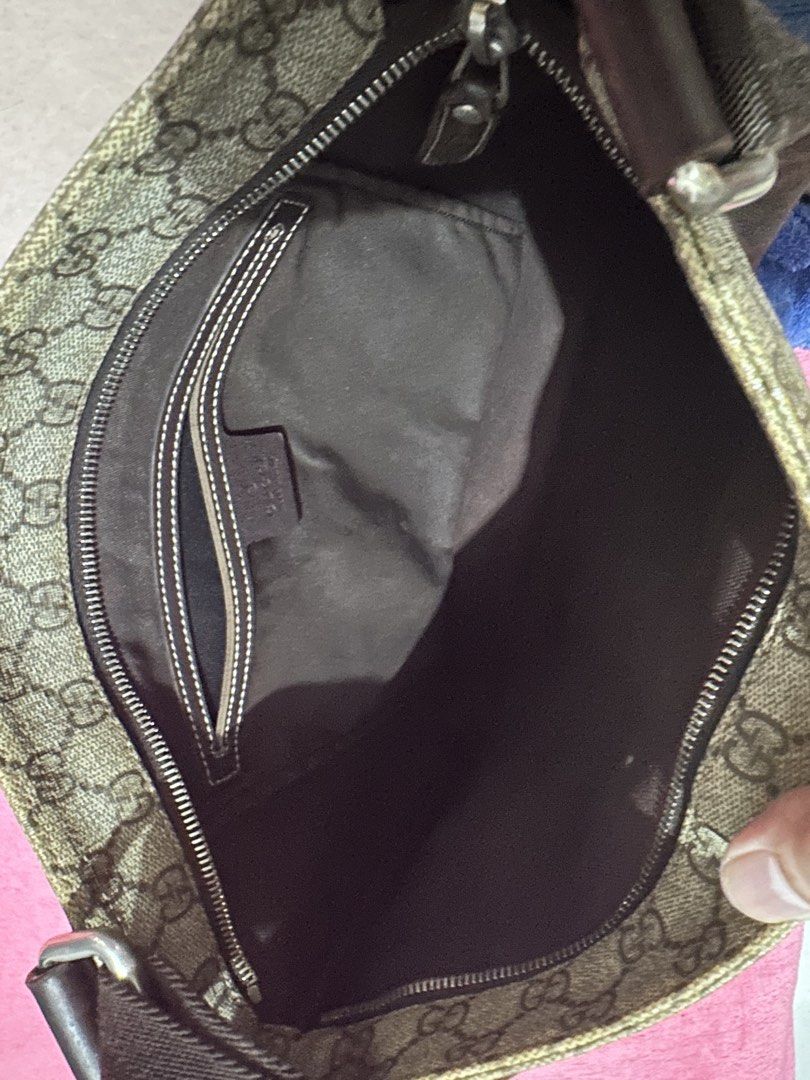 Gucci GG Supreme Messenger Bag (Category: Sling Bags) located in Quezon City. Submitted by pongoy (Listing ID 1470604095, Image 3). Description: - Authentic Gucci messenger bag in classic GG Supreme canvas - Adjustable brown shoulder strap with stylish dark brown leather trim - Secure zip top closure with branded metal pull - Spacious dark fabric interior with a convenient zip pocket for essentials - Premium hardware featuring engraved Gucci lett